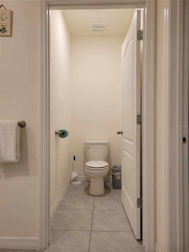 1378 Fox Squirrel Dr, Davenport, FL 33897 - bathroom with toilet, tile patterned floors, and baseboards