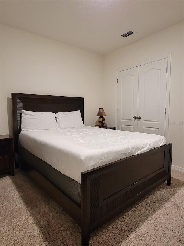 1378 Fox Squirrel Dr, Davenport, FL 33897 - bedroom with light colored carpet and a closet