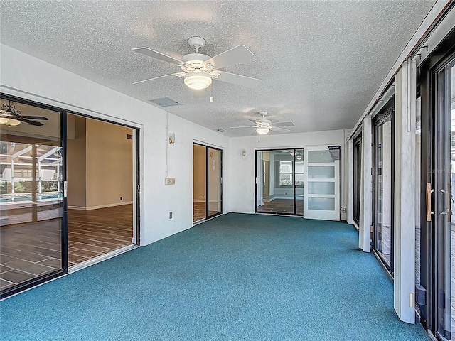 560 Saint Andrews Rd, Winter Haven, FL 33884 - unfurnished sunroom featuring a ceiling fan