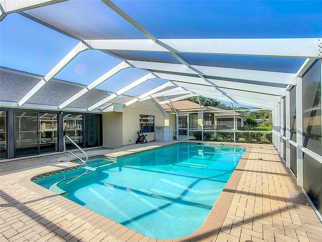 560 Saint Andrews Rd, Winter Haven, FL 33884 - swimming pool featuring a patio area and glass enclosure