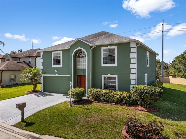1800 Emily Dr, Winter Haven, FL 33884 - view of front of home with stucco siding, an attached garage, concrete driveway, a front yard, and a shingled roof