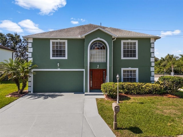 1800 Emily Dr, Winter Haven, FL 33884 - traditional-style home featuring stucco siding, concrete driveway, a garage, a front lawn, and roof with shingles