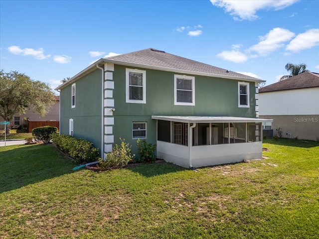 1800 Emily Dr, Winter Haven, FL 33884 - rear view of property featuring a sunroom and a yard