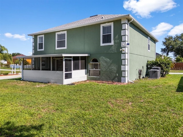 1800 Emily Dr, Winter Haven, FL 33884 - rear view of property featuring a sunroom, stucco siding, a lawn, and cooling unit