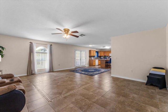 1800 Emily Dr, Winter Haven, FL 33884 - living area featuring ceiling fan and baseboards