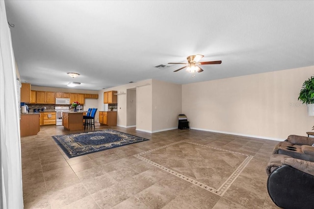 1800 Emily Dr, Winter Haven, FL 33884 - living area featuring ceiling fan and baseboards