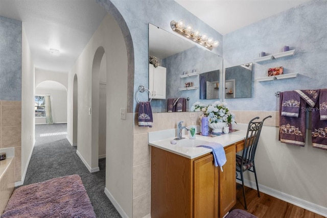 1800 Emily Dr, Winter Haven, FL 33884 - bathroom with vanity, a bath, and baseboards