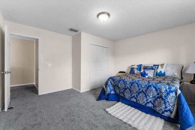 1800 Emily Dr, Winter Haven, FL 33884 - bedroom featuring carpet flooring, baseboards, a textured ceiling, and a closet