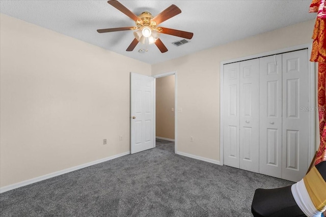 1800 Emily Dr, Winter Haven, FL 33884 - unfurnished bedroom with carpet floors, baseboards, a closet, and ceiling fan