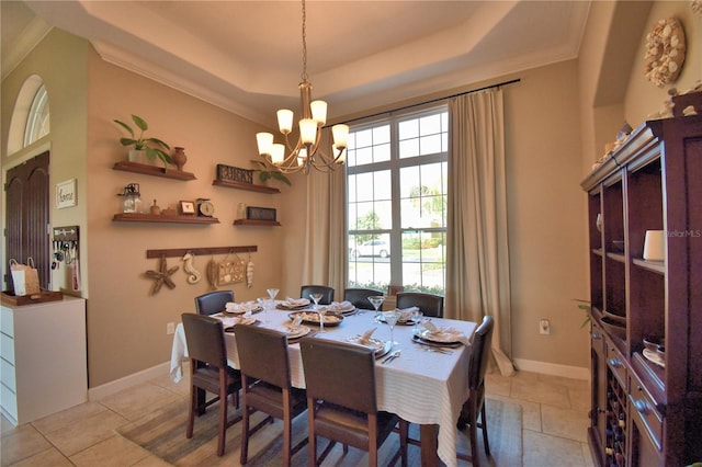 2340 Pinehurst Ct, Davenport, FL 33837 - dining room featuring a raised ceiling, a chandelier, light tile patterned floors, and ornamental molding
