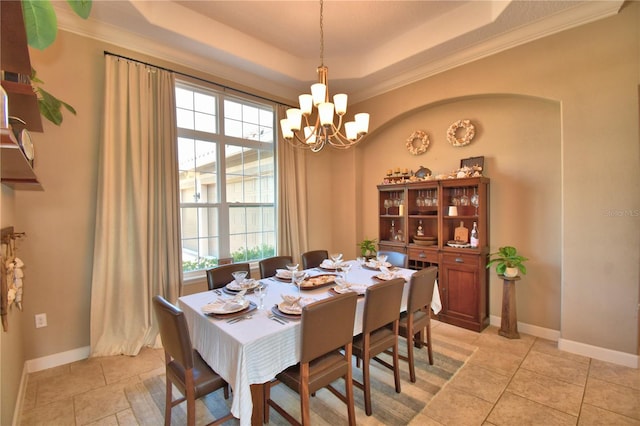 2340 Pinehurst Ct, Davenport, FL 33837 - dining room with a chandelier, a raised ceiling, crown molding, and light tile patterned flooring