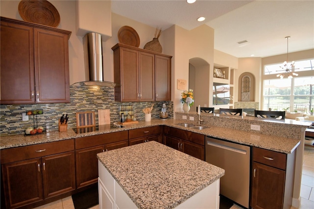 2340 Pinehurst Ct, Davenport, FL 33837 - kitchen featuring stainless steel dishwasher, black electric cooktop, a peninsula, tasteful backsplash, and recessed lighting