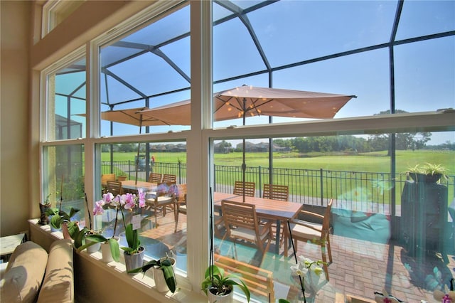 2340 Pinehurst Ct, Davenport, FL 33837 - sunroom featuring outdoor dining space and golf course view