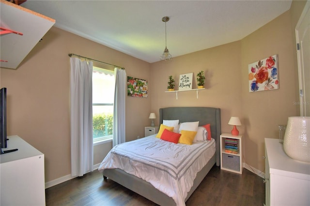 2340 Pinehurst Ct, Davenport, FL 33837 - bedroom with dark wood-style flooring and baseboards