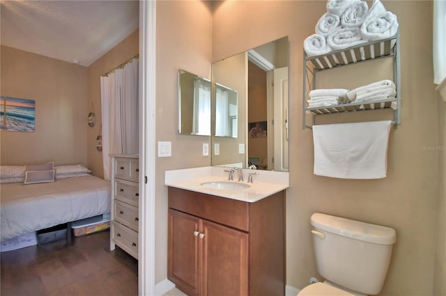 2340 Pinehurst Ct, Davenport, FL 33837 - full bathroom featuring vanity and wood finished floors