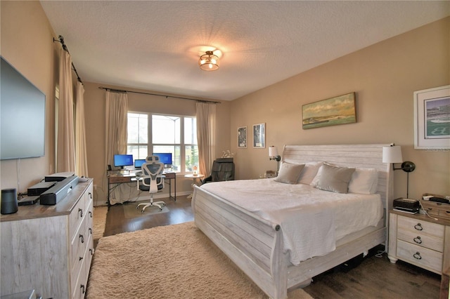 2340 Pinehurst Ct, Davenport, FL 33837 - bedroom with dark wood finished floors, an office area, and a textured ceiling