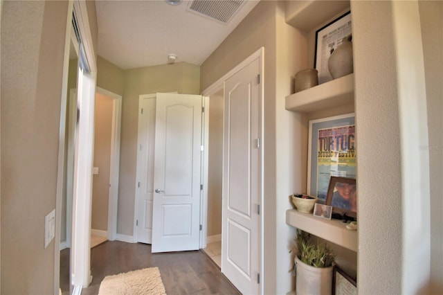 2340 Pinehurst Ct, Davenport, FL 33837 - hallway featuring wood finished floors and baseboards