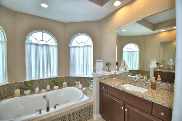 2340 Pinehurst Ct, Davenport, FL 33837 - full bathroom featuring a garden tub, plenty of natural light, vanity, and recessed lighting
