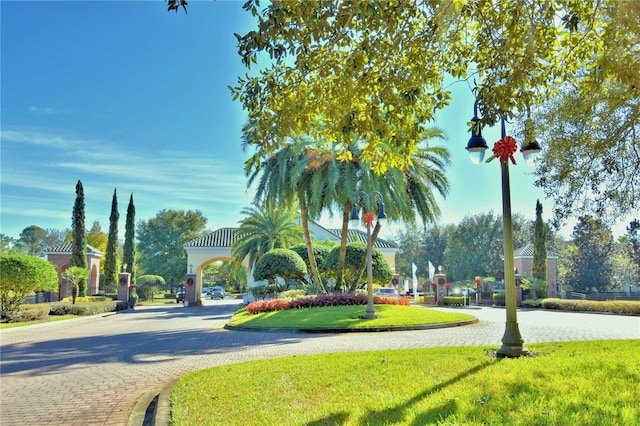 2340 Pinehurst Ct, Davenport, FL 33837 - view of street with curbs and a gated entry