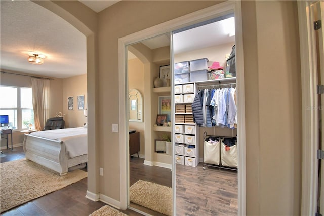2340 Pinehurst Ct, Davenport, FL 33837 - bathroom featuring wood finished floors and baseboards