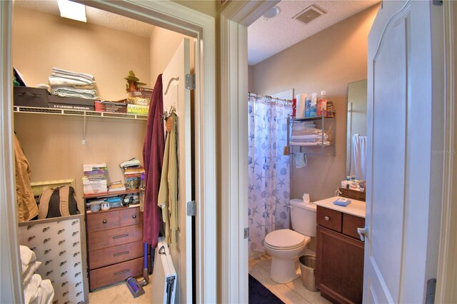 2340 Pinehurst Ct, Davenport, FL 33837 - bathroom with a shower with curtain, vanity, and tile patterned floors