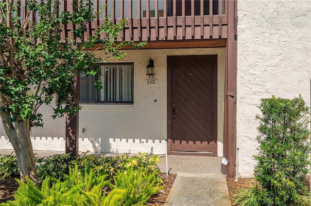 5102 Village Ct Unit E-2, Lake Wales, FL 33898 - property entrance with stucco siding