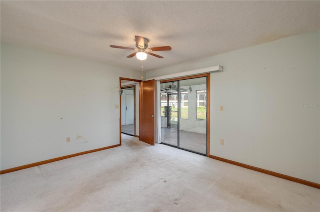 5102 Village Ct Unit E-2, Lake Wales, FL 33898 - carpeted spare room with a ceiling fan, baseboards, and a textured ceiling