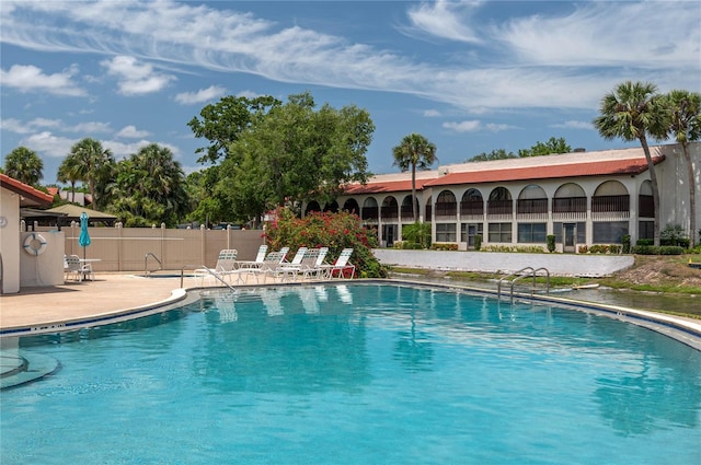 5102 Village Ct Unit E-2, Lake Wales, FL 33898 - community pool featuring a patio and fence