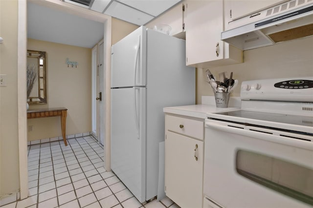 713 Olde Camelot Cir Unit 3303-4, Haines City, FL 33844 - kitchen featuring white appliances, under cabinet range hood, light countertops, white cabinets, and light tile patterned flooring