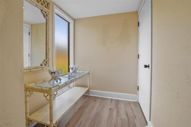 713 Olde Camelot Cir Unit 3303-4, Haines City, FL 33844 - corridor with wood finished floors and baseboards