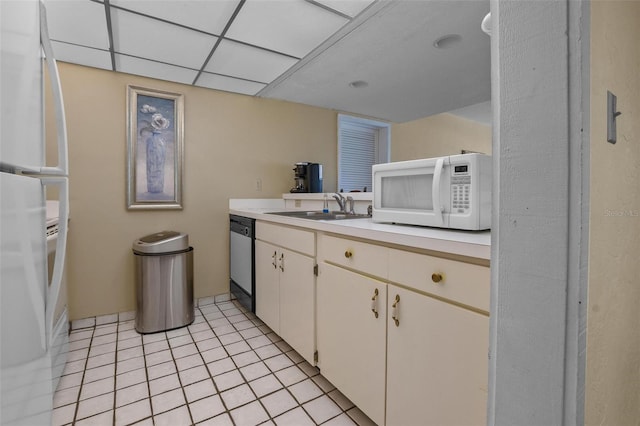713 Olde Camelot Cir Unit 3303-4, Haines City, FL 33844 - kitchen featuring white appliances, a sink, light countertops, light tile patterned flooring, and white cabinetry