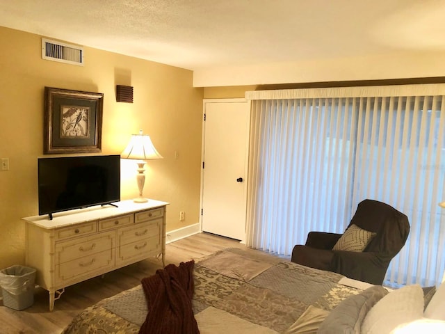 713 Olde Camelot Cir Unit 3303-4, Haines City, FL 33844 - living room featuring wood finished floors and baseboards