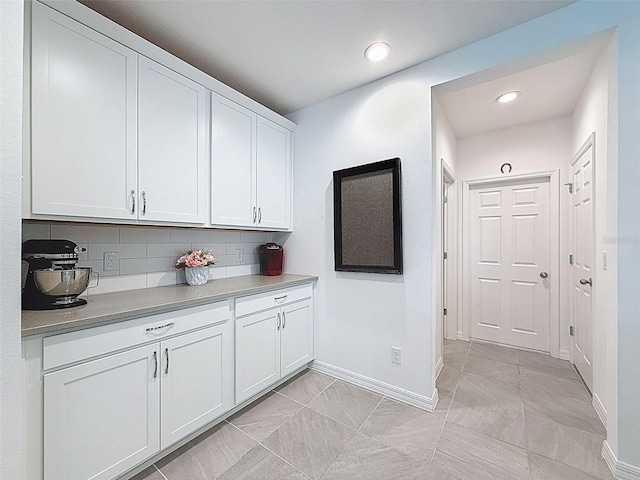 912 Scrub Oak Hammock Rd, Davenport, FL 33837 - kitchen featuring baseboards, white cabinets, light countertops, backsplash, and recessed lighting