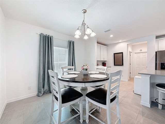 912 Scrub Oak Hammock Rd, Davenport, FL 33837 - dining area featuring a chandelier, baseboards, light tile patterned floors, and recessed lighting