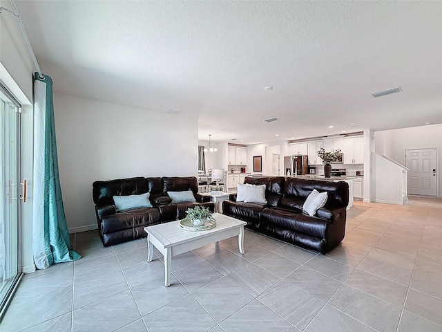912 Scrub Oak Hammock Rd, Davenport, FL 33837 - living room with light tile patterned floors, a textured ceiling, and recessed lighting