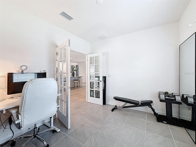 912 Scrub Oak Hammock Rd, Davenport, FL 33837 - home office with french doors and tile patterned floors