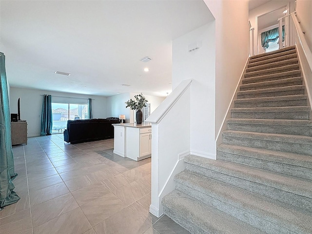 912 Scrub Oak Hammock Rd, Davenport, FL 33837 - stairs with baseboards, recessed lighting, and tile patterned floors