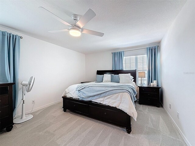 912 Scrub Oak Hammock Rd, Davenport, FL 33837 - bedroom featuring carpet floors, a ceiling fan, a textured ceiling, and baseboards