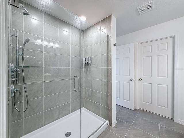 912 Scrub Oak Hammock Rd, Davenport, FL 33837 - bathroom with a shower stall, tile patterned floors, and baseboards
