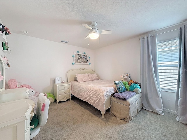 912 Scrub Oak Hammock Rd, Davenport, FL 33837 - bedroom featuring light colored carpet, ceiling fan, and a textured ceiling