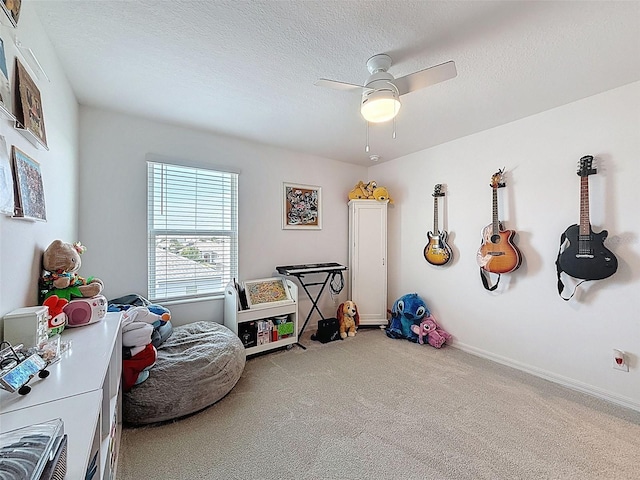 912 Scrub Oak Hammock Rd, Davenport, FL 33837 - game room featuring carpet flooring, ceiling fan, a textured ceiling, and baseboards