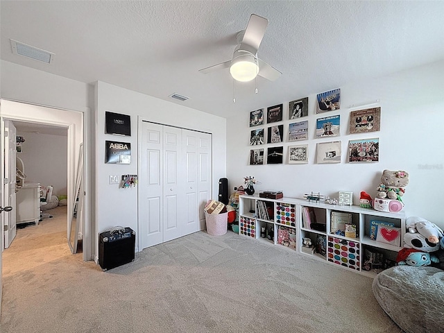 912 Scrub Oak Hammock Rd, Davenport, FL 33837 - playroom with carpet flooring, ceiling fan, and a textured ceiling