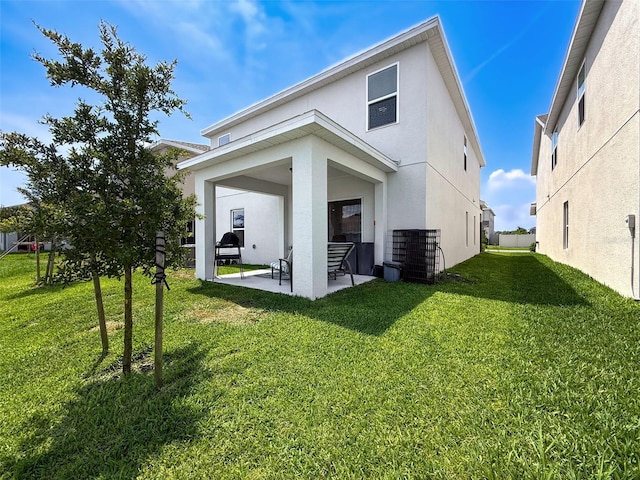 912 Scrub Oak Hammock Rd, Davenport, FL 33837 - rear view of property with stucco siding, a patio, central air condition unit, and a yard