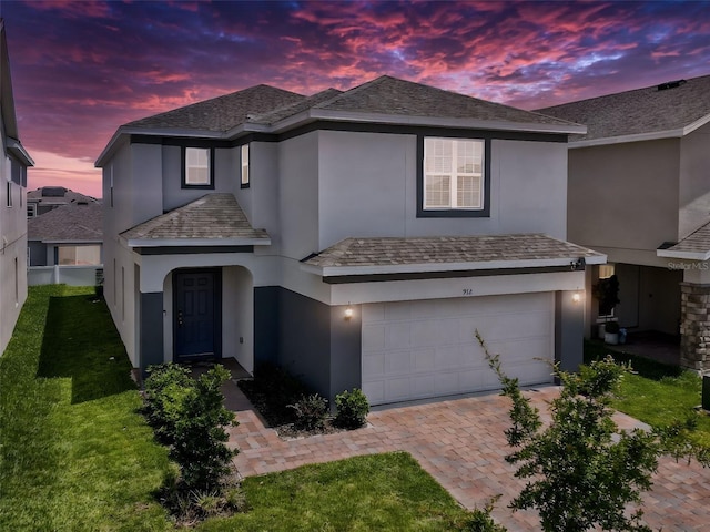 912 Scrub Oak Hammock Rd, Davenport, FL 33837 - view of front of house with a garage, stucco siding, driveway, and a front lawn