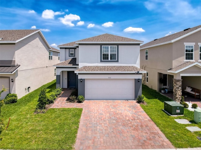 912 Scrub Oak Hammock Rd, Davenport, FL 33837 - traditional-style home with a garage, stucco siding, a front yard, and decorative driveway