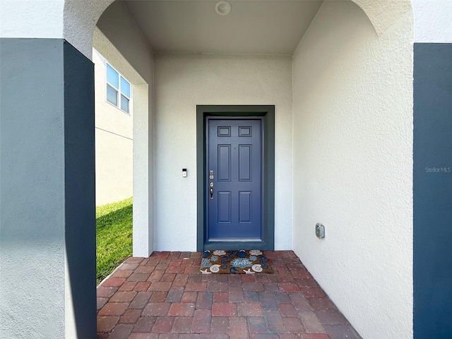 912 Scrub Oak Hammock Rd, Davenport, FL 33837 - doorway to property featuring stucco siding