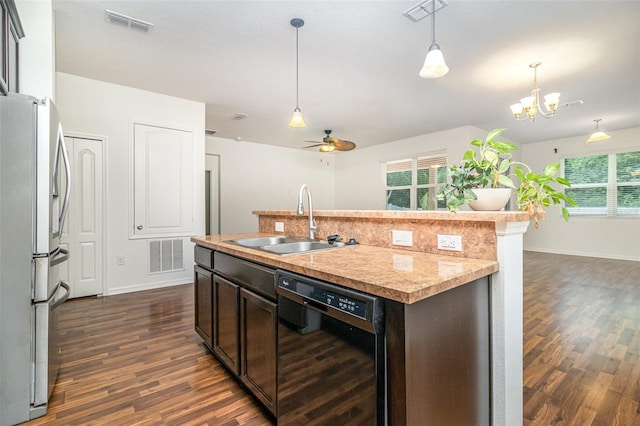 122 Port Royal Ct, Sebastian, FL 32958 - kitchen featuring black dishwasher, a sink, freestanding refrigerator, and dark wood-style floors