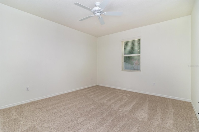 122 Port Royal Ct, Sebastian, FL 32958 - spare room featuring light colored carpet, baseboards, and a ceiling fan