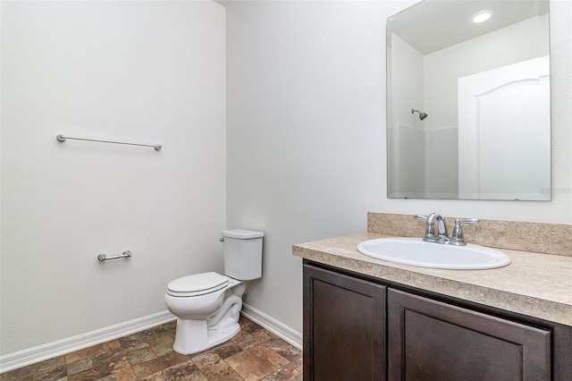 122 Port Royal Ct, Sebastian, FL 32958 - full bathroom with baseboards, stone finish flooring, toilet, and vanity