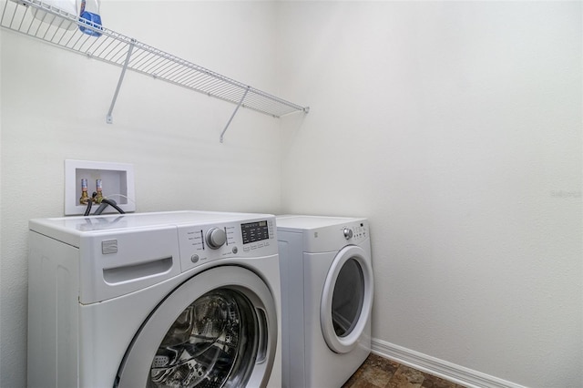 122 Port Royal Ct, Sebastian, FL 32958 - washroom featuring washer and clothes dryer and baseboards